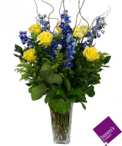 Our Lone Star roses has everything to represent US... Yellow Roses for the Yellow Rose of Texas, delphinium represents the bluebonnets that grow on the sides of our roads, and the accent of solidago represents our wildflowers. BEAUTIFUL!