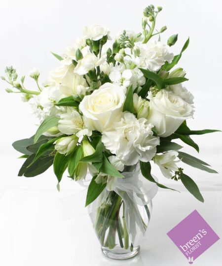 This bloom on bloom design features a modern and elegance arrangement designed in all white flowers.