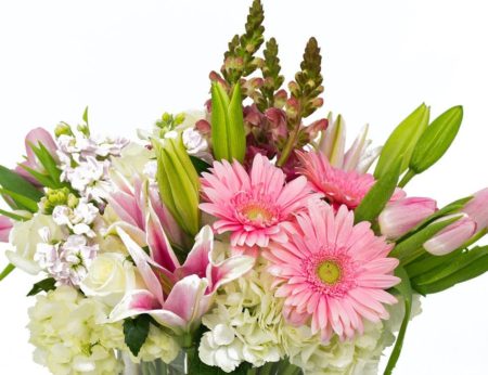 Pink Tulips, Gerbers, Lilies, Snapdragons and more. Low, Lush and Beautiful. This arrangement is four-sided, flowers all around for beautiful at all angles.
