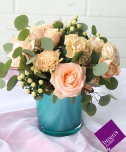 This design is inspired by abstract painter AGNES MARTIN and her painting titled UNTITLED #10, which embraces peach tones like the strips in her art piece. Our arrangement features peach roses, spray roses, and heirlooms for a wonderful and soft display